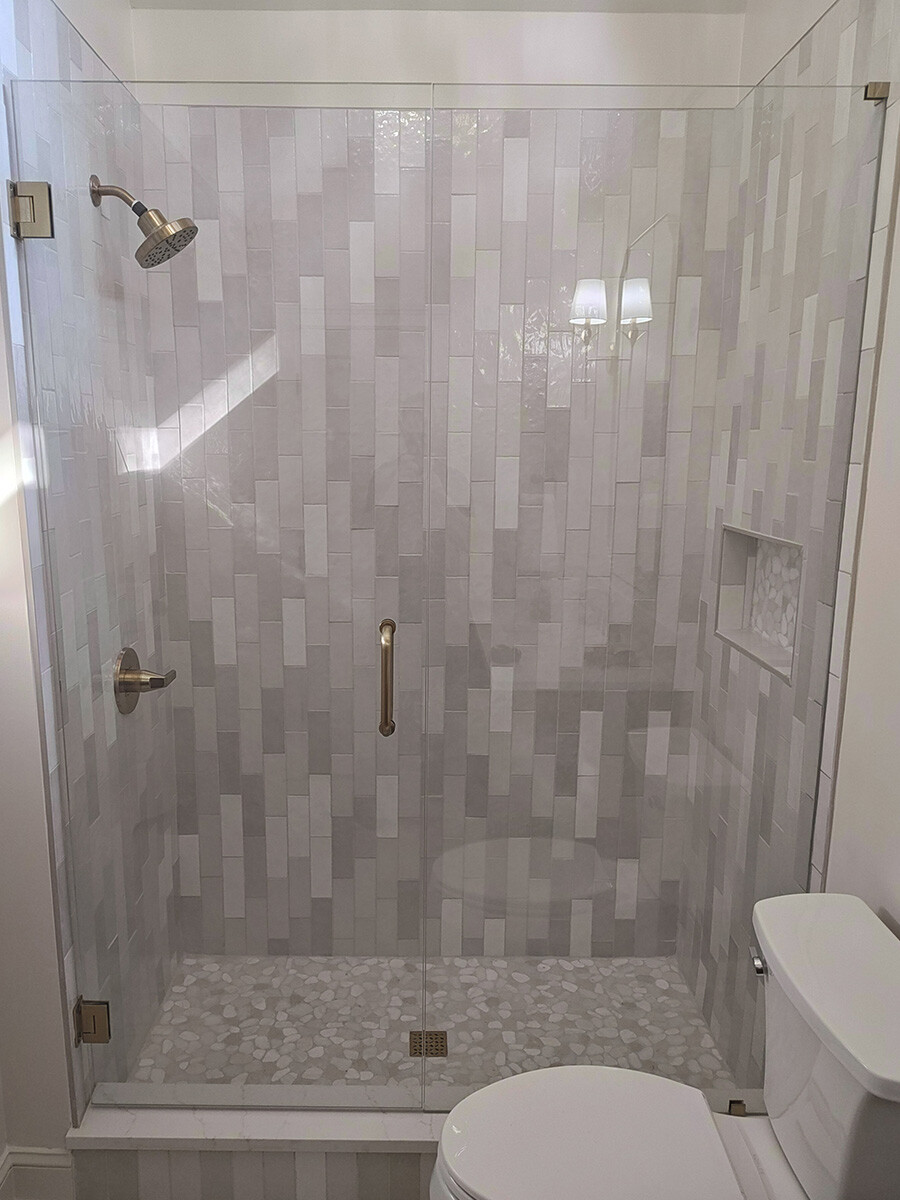 Inline glass shower door installed in Alpharetta, GA.